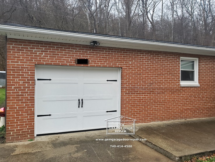 Recessed wide panel door with carriage hardware